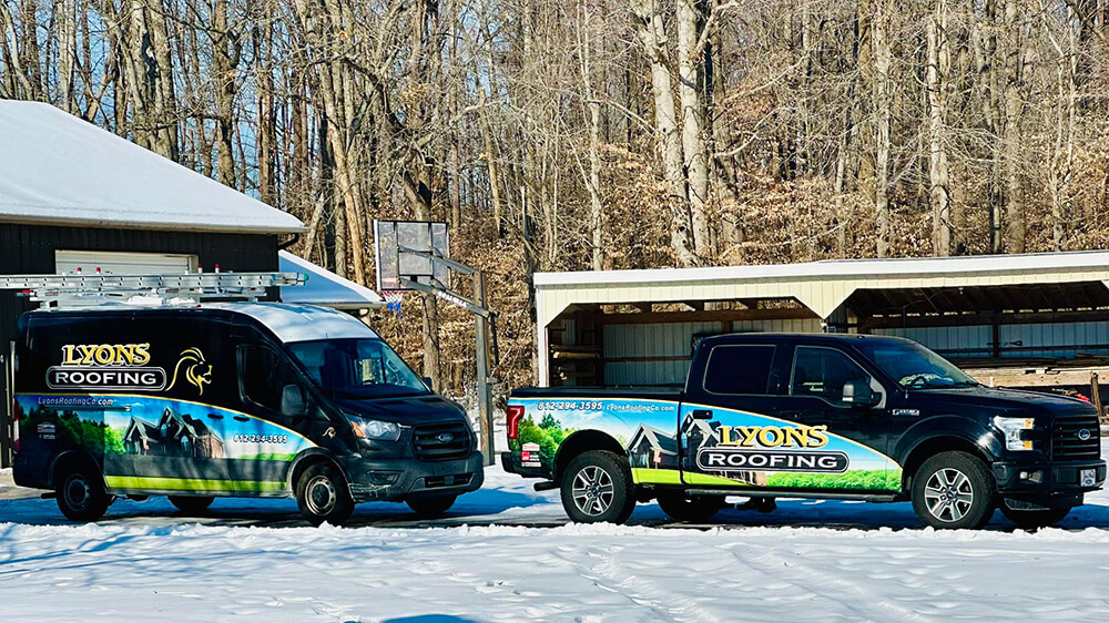 Lyons Roofing Co showing off their beautiful trucks
